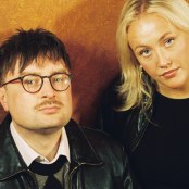 Members of the band 'Majesty Palm' leaning against a wall.